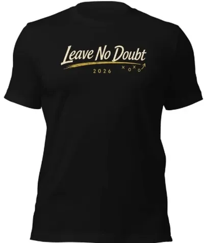 Black t-shirt with Leave No Doubt in cream script across the chest, a gold play-diagram underline, and 2026