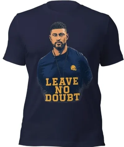 Navy t-shirt with a sideline portrait of Marcus Freeman above gold block letters reading Leave No Doubt